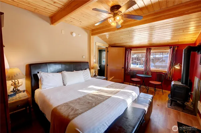 a bed room with a bed and a tv