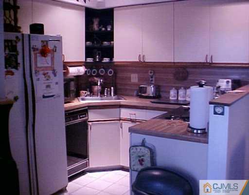 199 Evergreen Road, Unit 12A Edison, NJ 08837 - Photo 7 of 7 a room with storage and utility
