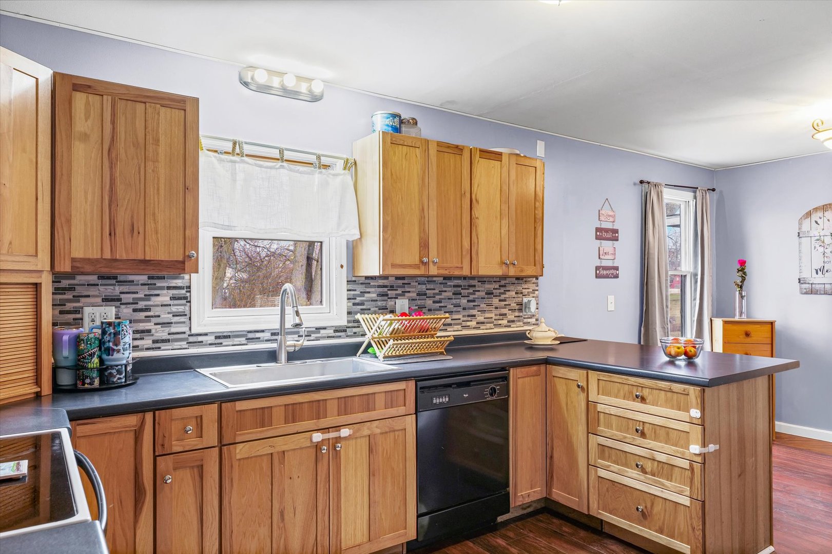 108 Maple Street Roberts, IL 60962 - Photo 11 of 28 a kitchen with stainless steel appliances a sink stove and cabinets