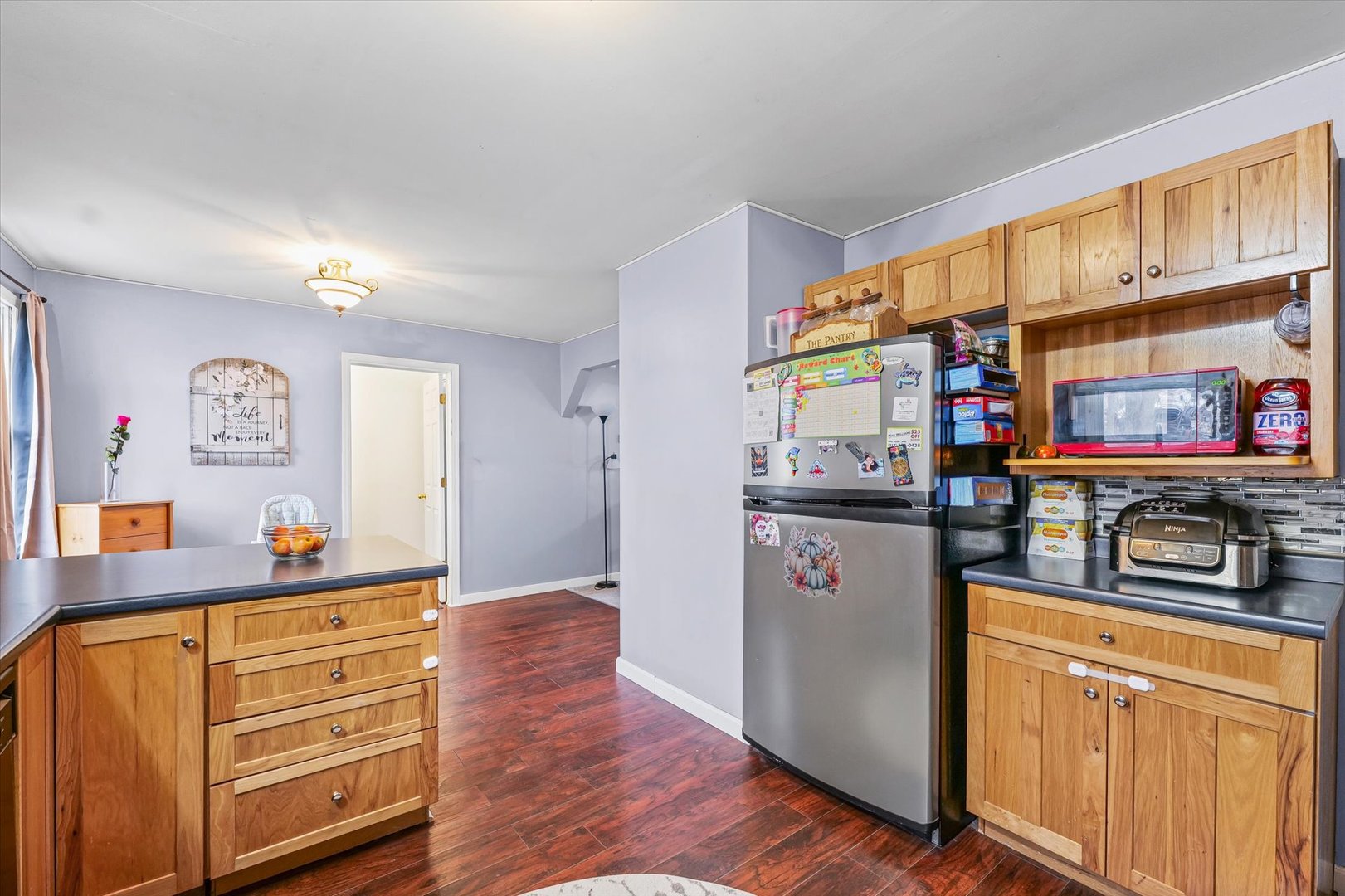 108 Maple Street Roberts, IL 60962 - Photo 13 of 28 a kitchen with stainless steel appliances granite countertop a refrigerator and stove
