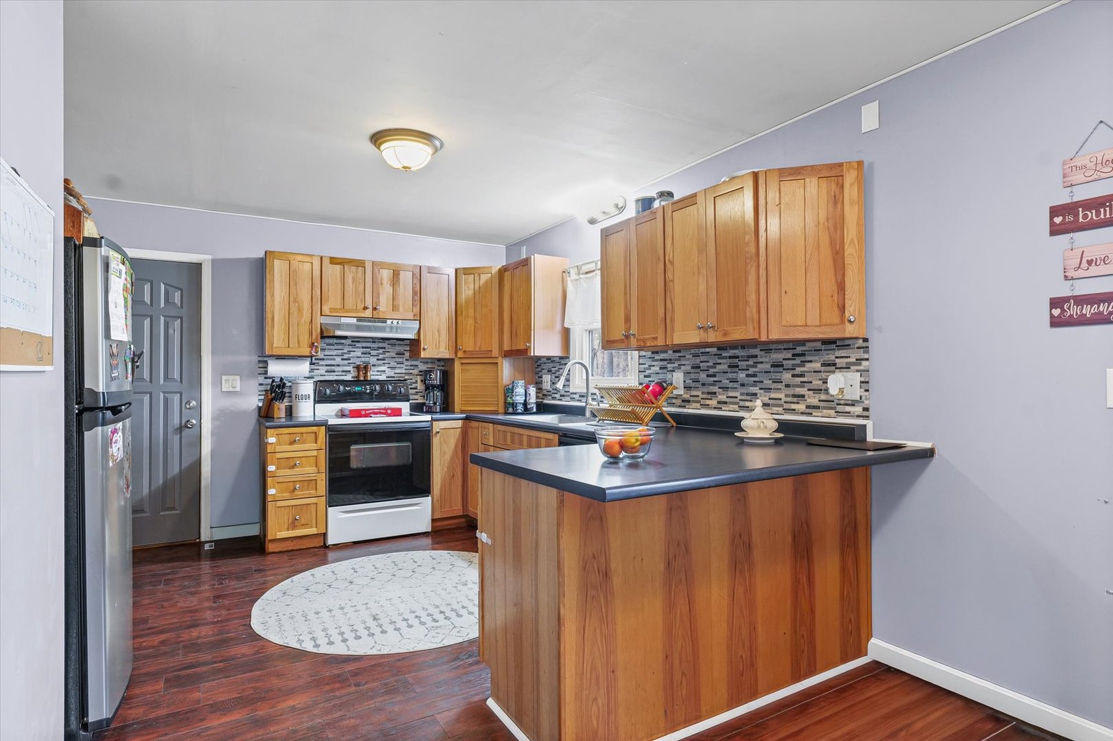 108 Maple Street Roberts, IL 60962 - Photo 9 of 28 a kitchen with a refrigerator a stove top oven a sink and dishwasher