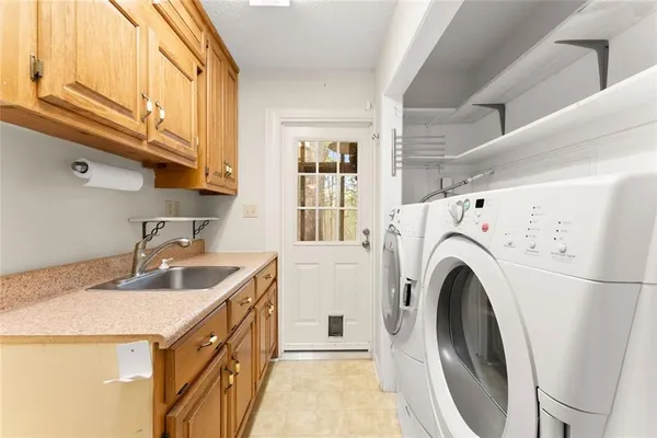 a bathroom with a granite countertop toilet a sink and a mirror