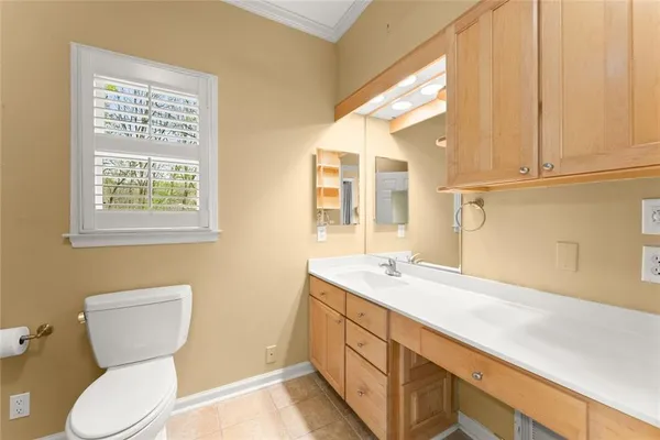 a white toilet sitting next to a bath tub and shower