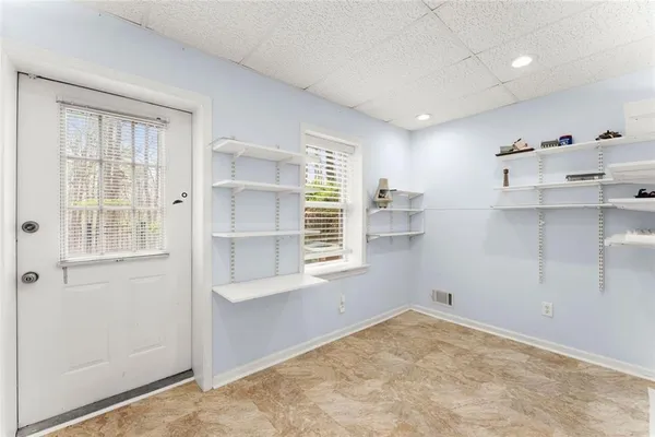 a view of an empty room with a window