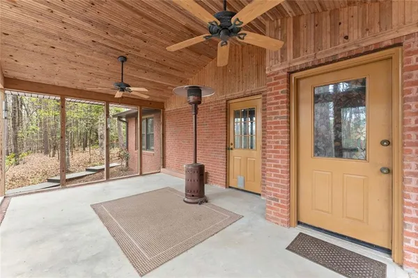 a view of backyard of house with green space