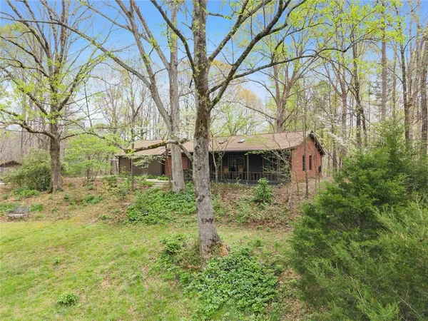 a backyard of a house with lots of green space