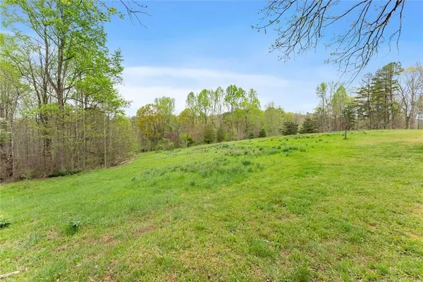 a view of a field with an outdoor space