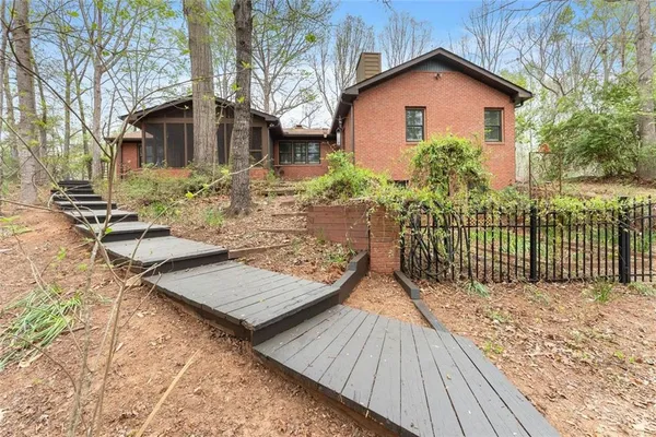a backyard of a house with lots of green space