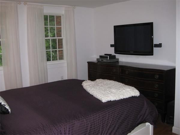 16 Whippletree Road Chelmsford, MA 01824 - Photo 14 of 22 a living room with a flat screen tv and a fireplace