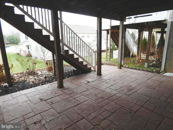 a view of a house with a wooden deck