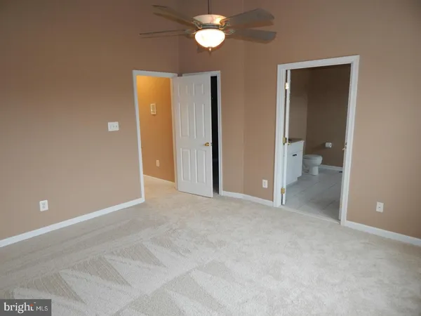 a view of an empty room with a bathroom