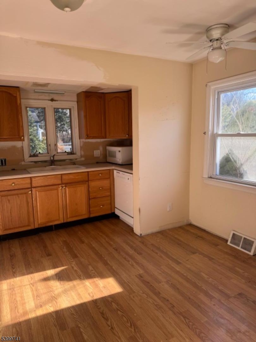 6 Maple Lane Hampton, NJ 08827 - Photo 3 of 13 a view of a kitchen with a sink hardwood floor and a large window