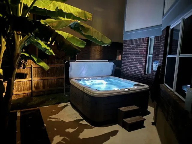 a view of jacuzzi with outdoor seating