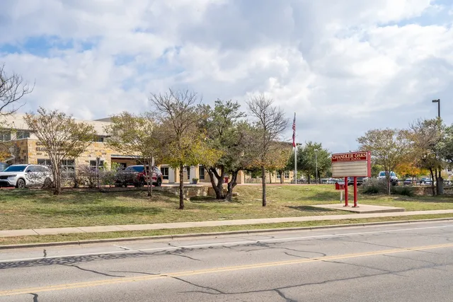 a view of a city with apartment building in the background