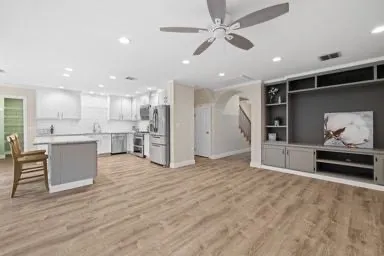 a view of kitchen with stainless steel appliances refrigerator oven microwave and stove