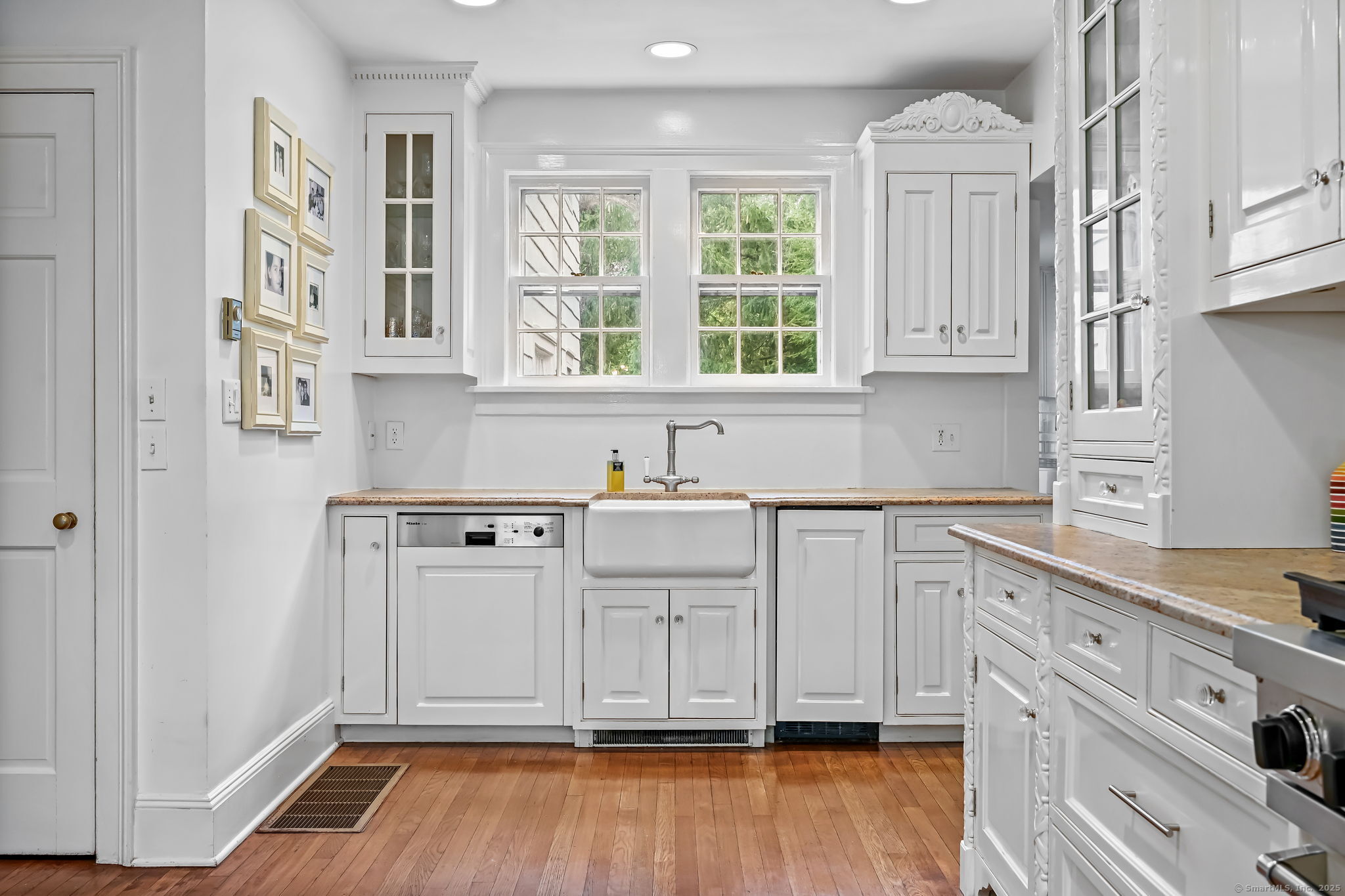 330 Ridgefield Road Wilton, CT 06897 - Photo 15 of 40 a view of a kitchen with cabinets and wooden floor