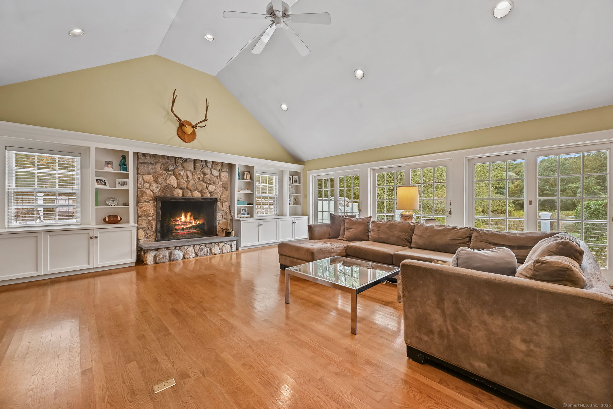 330 Ridgefield Road Wilton, CT 06897 - Photo 19 of 40 a living room with furniture and a fireplace