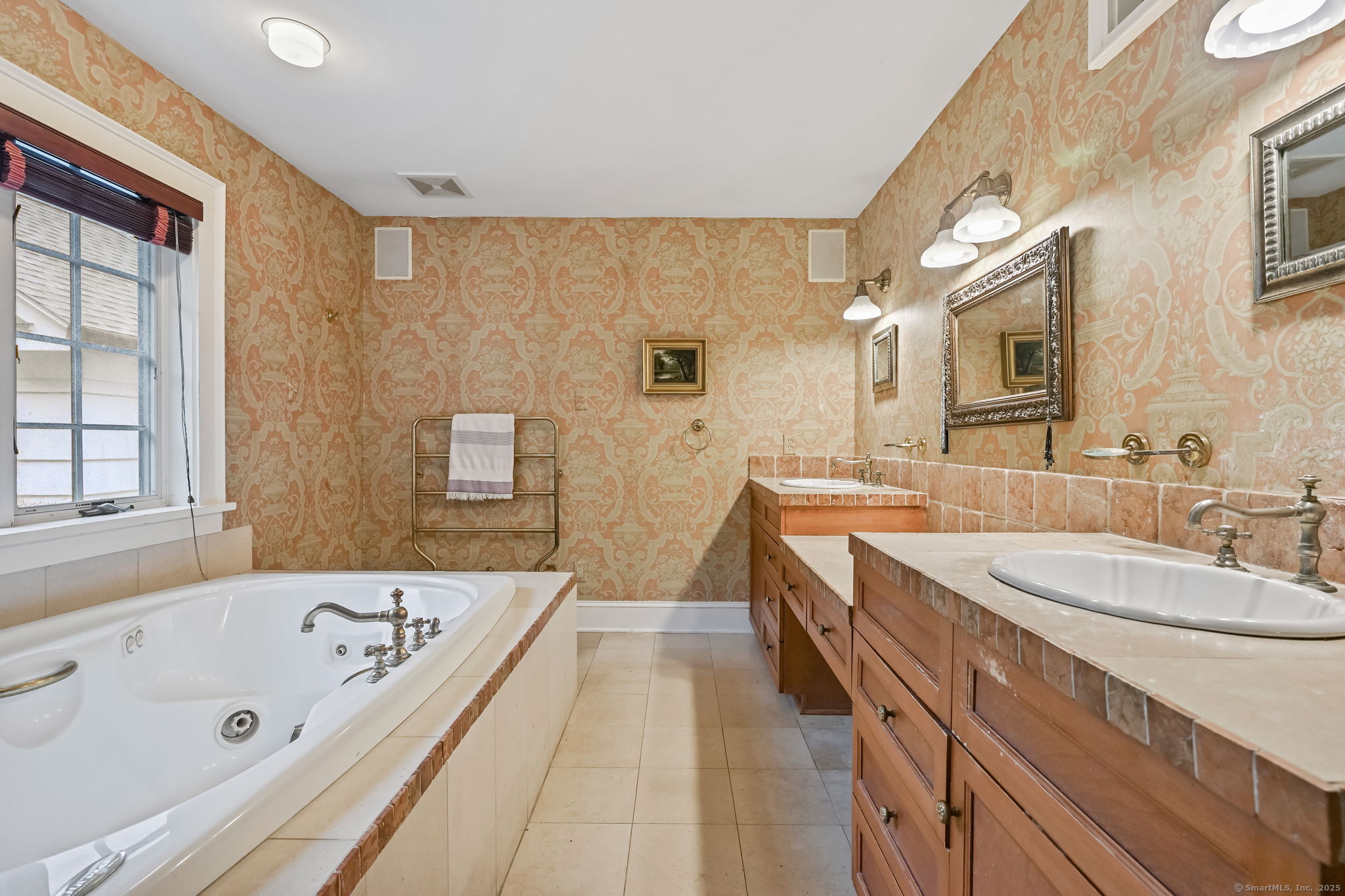330 Ridgefield Road Wilton, CT 06897 - Photo 22 of 40 a bathroom with a tub a sink and a large mirror