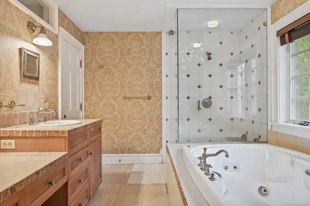 a bathroom with a bathtub and a sink