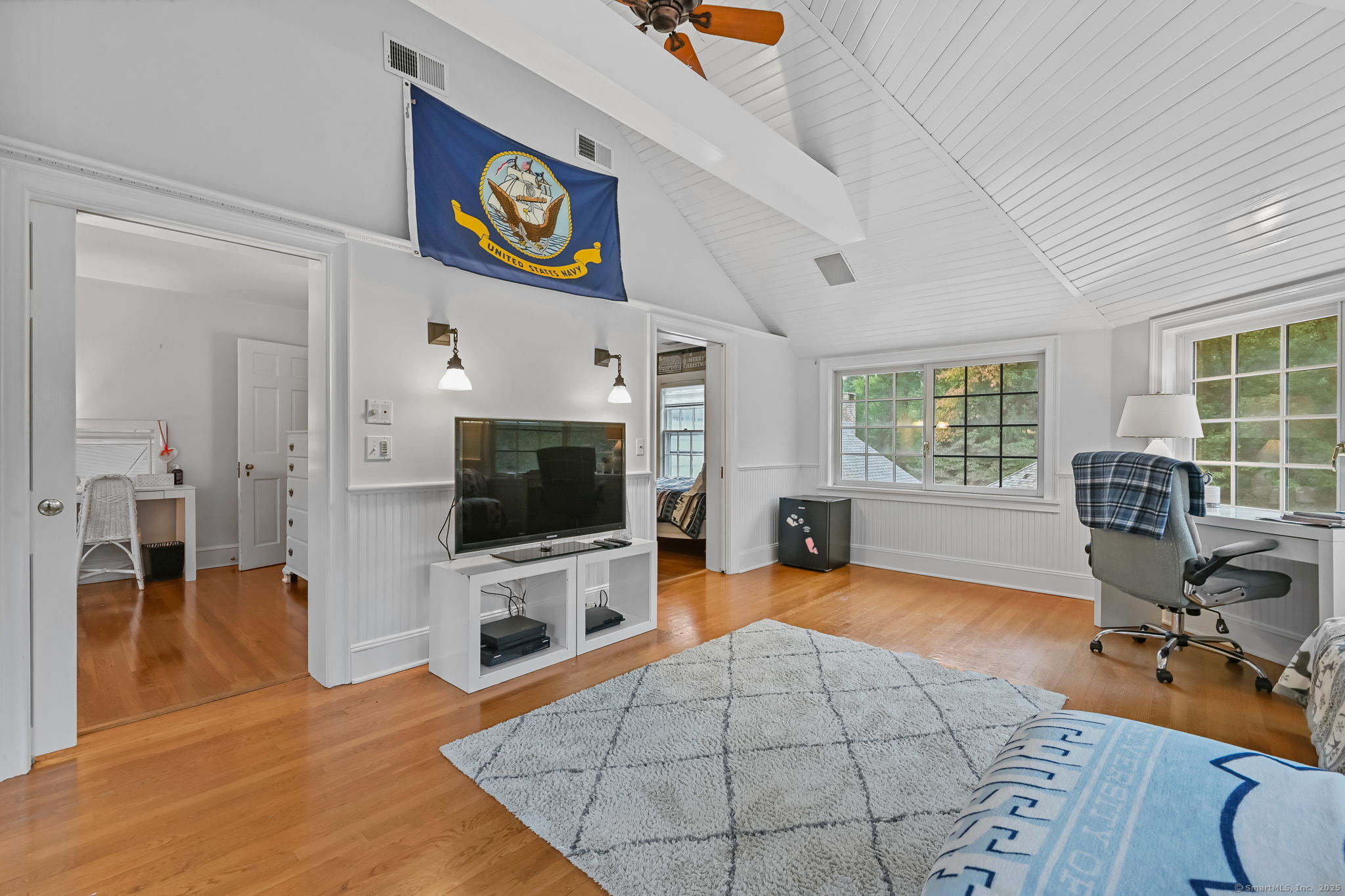 330 Ridgefield Road Wilton, CT 06897 - Photo 27 of 40 a living room with furniture and a flat screen tv
