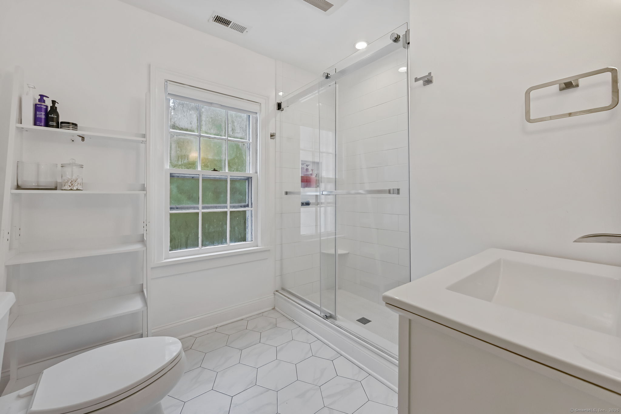 330 Ridgefield Road Wilton, CT 06897 - Photo 29 of 40 a bathroom with a sink a toilet and shower