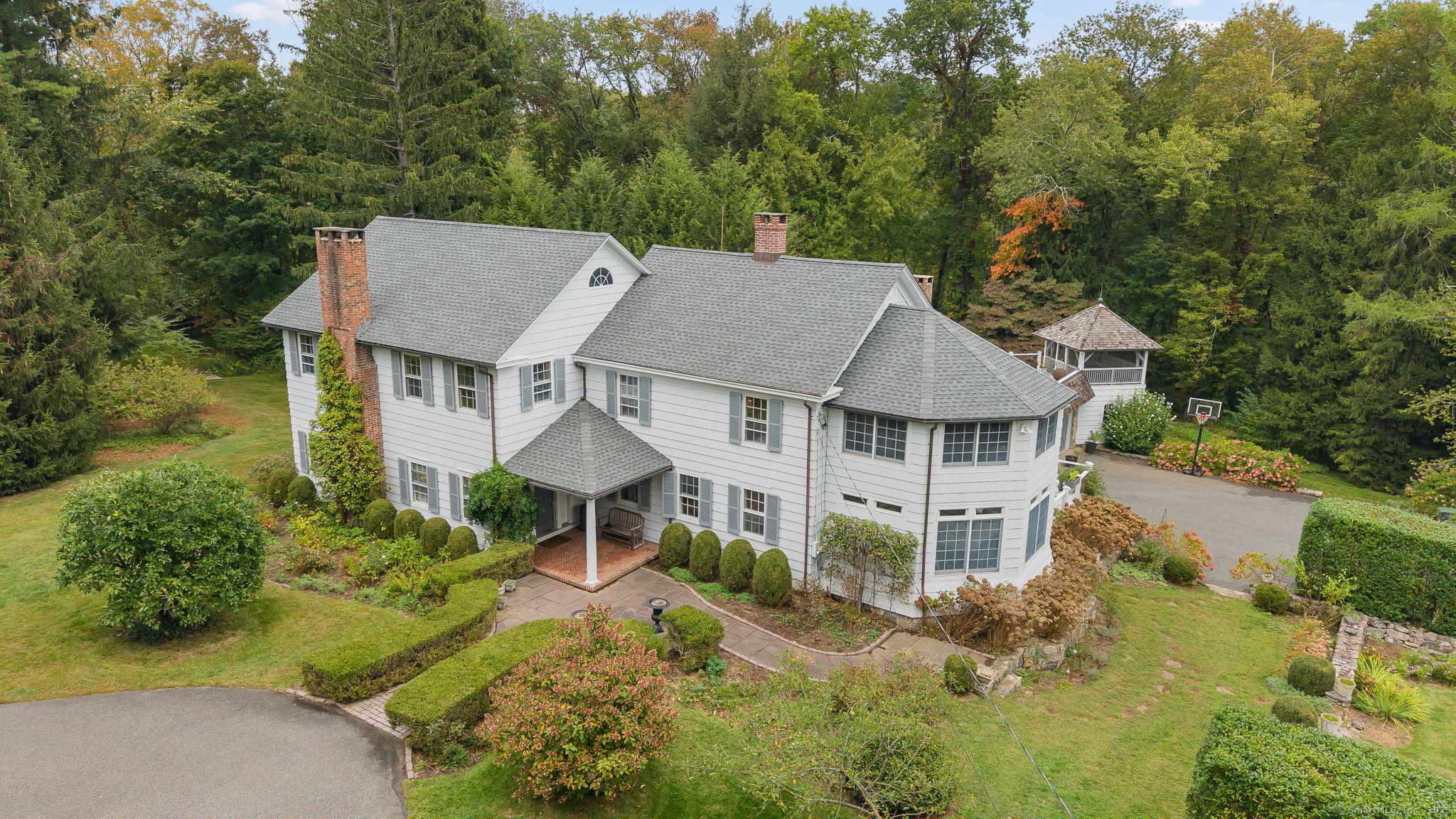 330 Ridgefield Road Wilton, CT 06897 - Photo 3 of 40 front view of a house with a yard