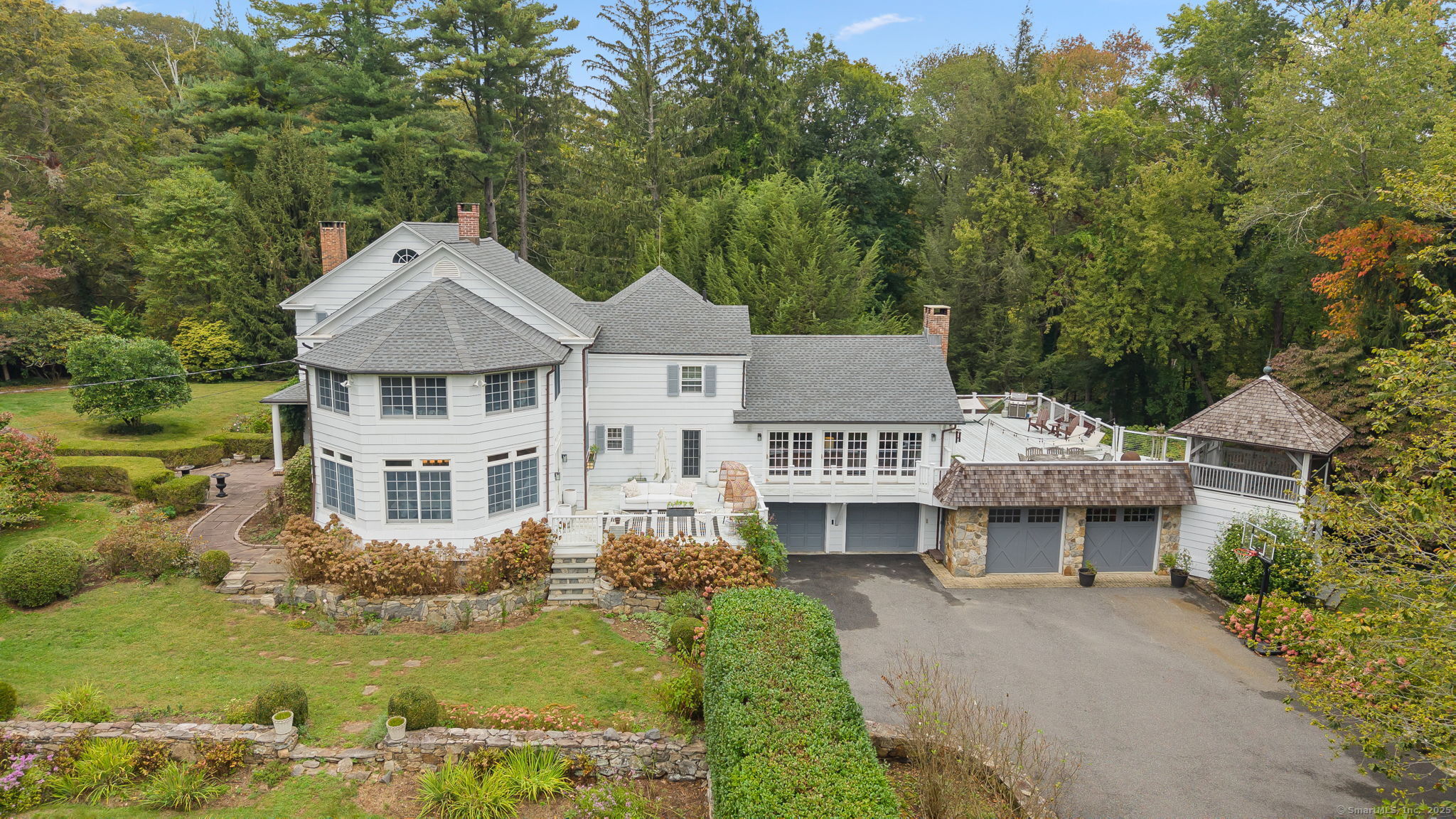 330 Ridgefield Road Wilton, CT 06897 - Photo 31 of 40 a front view of a house with a yard