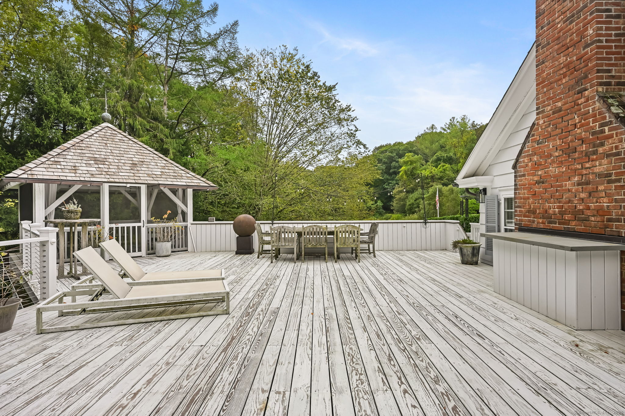 330 Ridgefield Road Wilton, CT 06897 - Photo 32 of 40 a view of a house with wooden deck