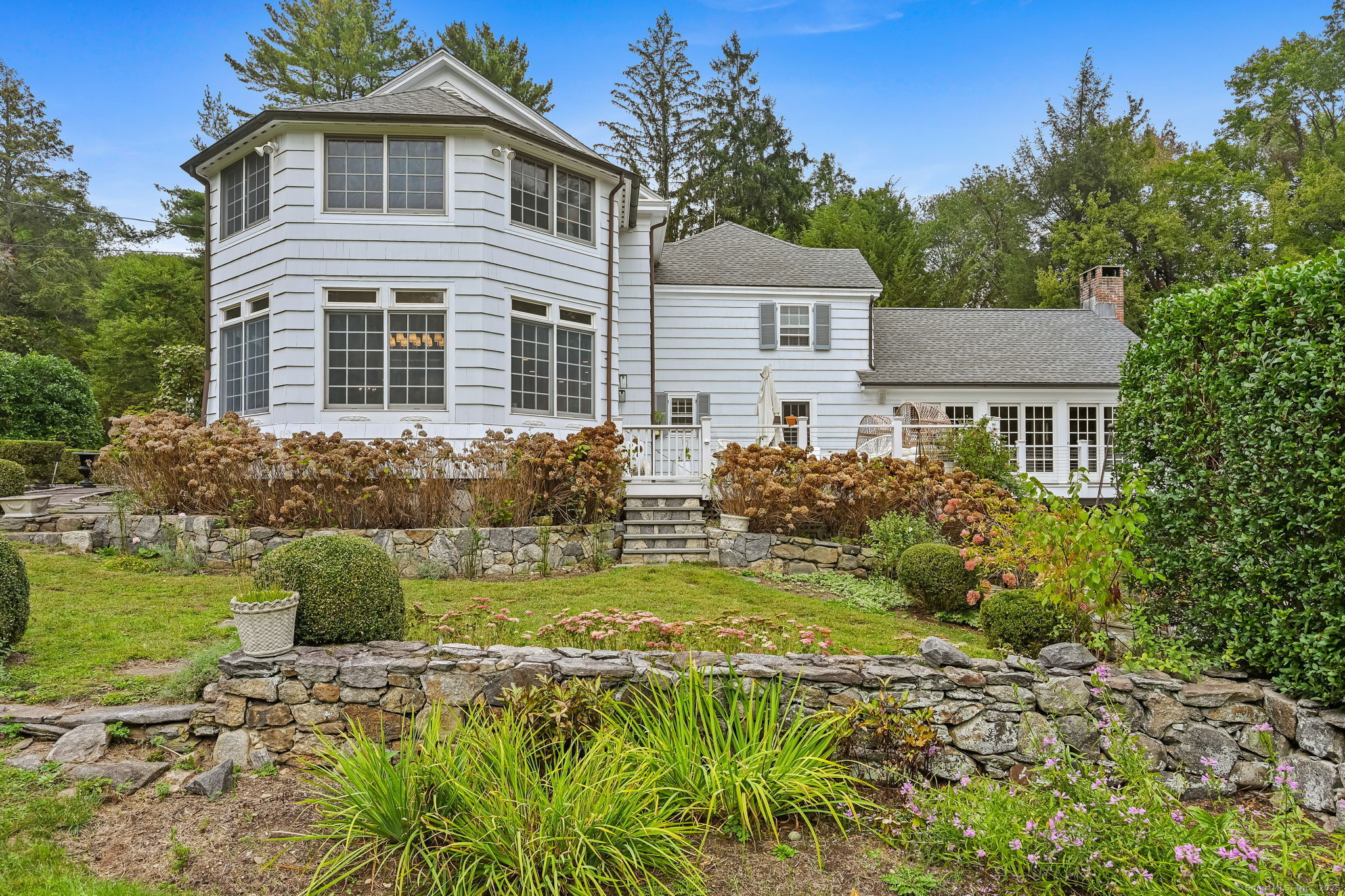 330 Ridgefield Road Wilton, CT 06897 - Photo 35 of 40 a front view of a house with a yard