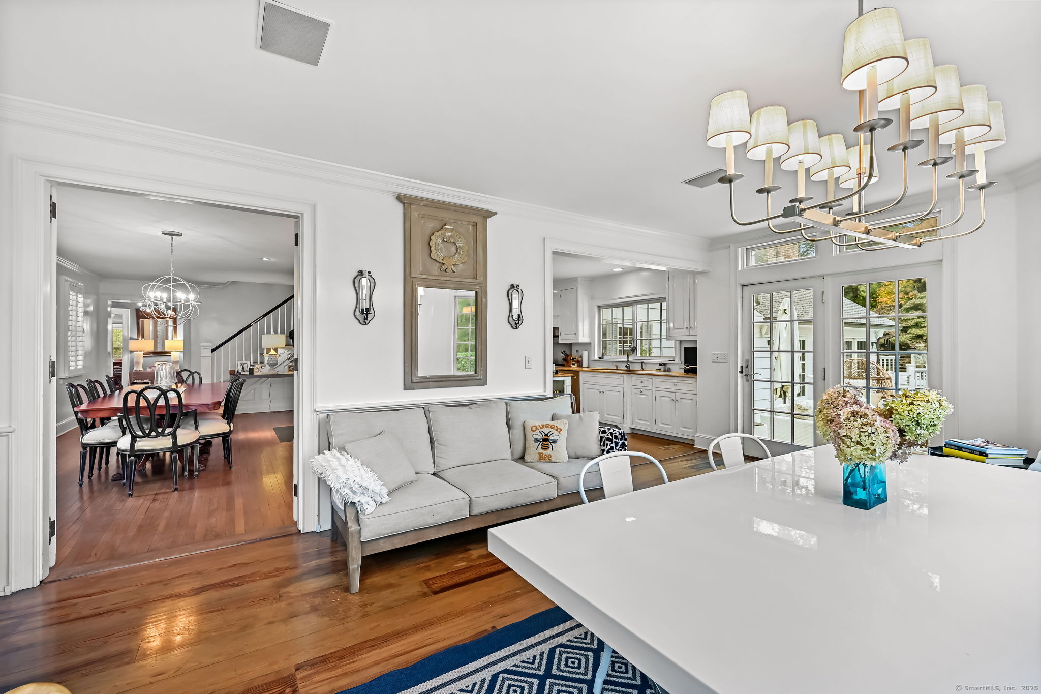 330 Ridgefield Road Wilton, CT 06897 - Photo 10 of 40 a living room with fireplace furniture and a chandelier