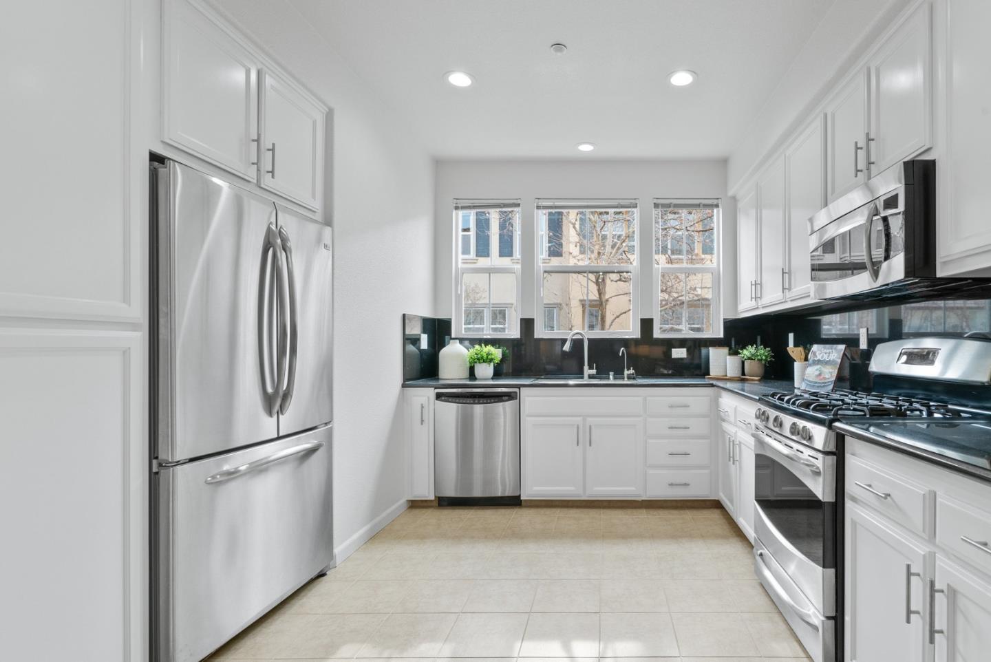 1520 Avina Circle, Unit 2 Santa Clara, CA 95054 - Photo 13 of 39 a kitchen with stainless steel appliances granite countertop a refrigerator a stove and a sink