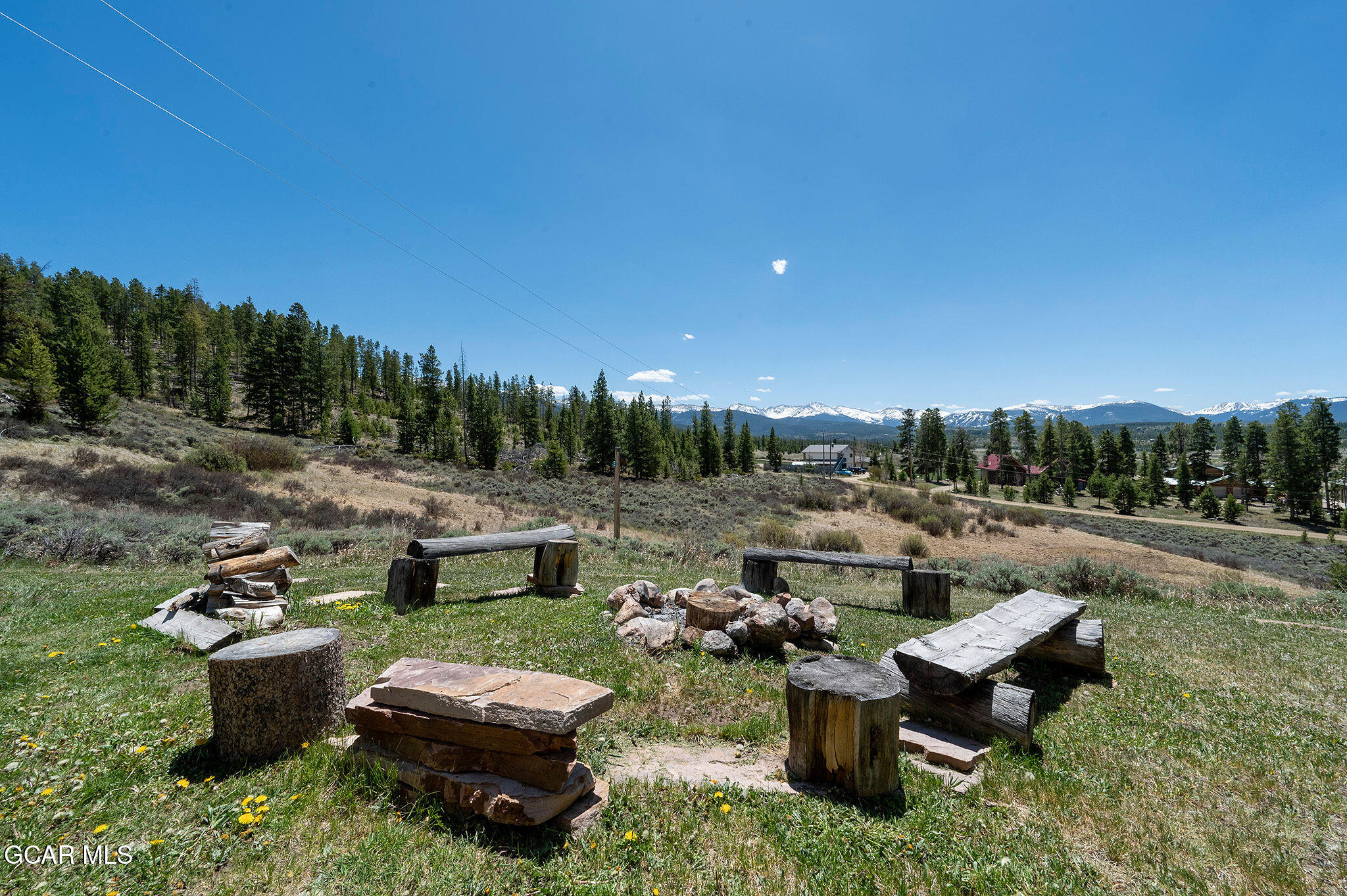 732 Gcr 8311/ Clayton Ranch Road Tabernash, CO 80478 - Photo 52 of 65 a view of a fire pit in a backyard