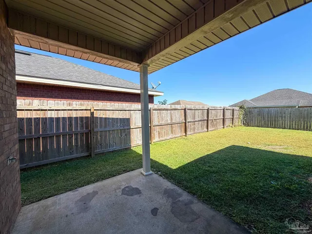 a view of a swimming pool and a yard
