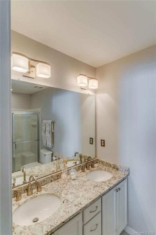11650 Rabbit Ridge Road, Unit 2071 Charlotte, NC 28270 - Photo 14 of 26 a bathroom with a granite countertop sink and a mirror