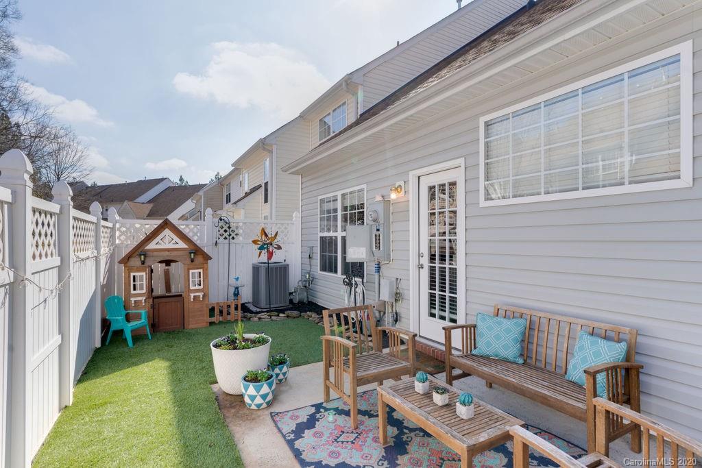 11650 Rabbit Ridge Road, Unit 2071 Charlotte, NC 28270 - Photo 22 of 26 a view of a house with backyard and sitting area