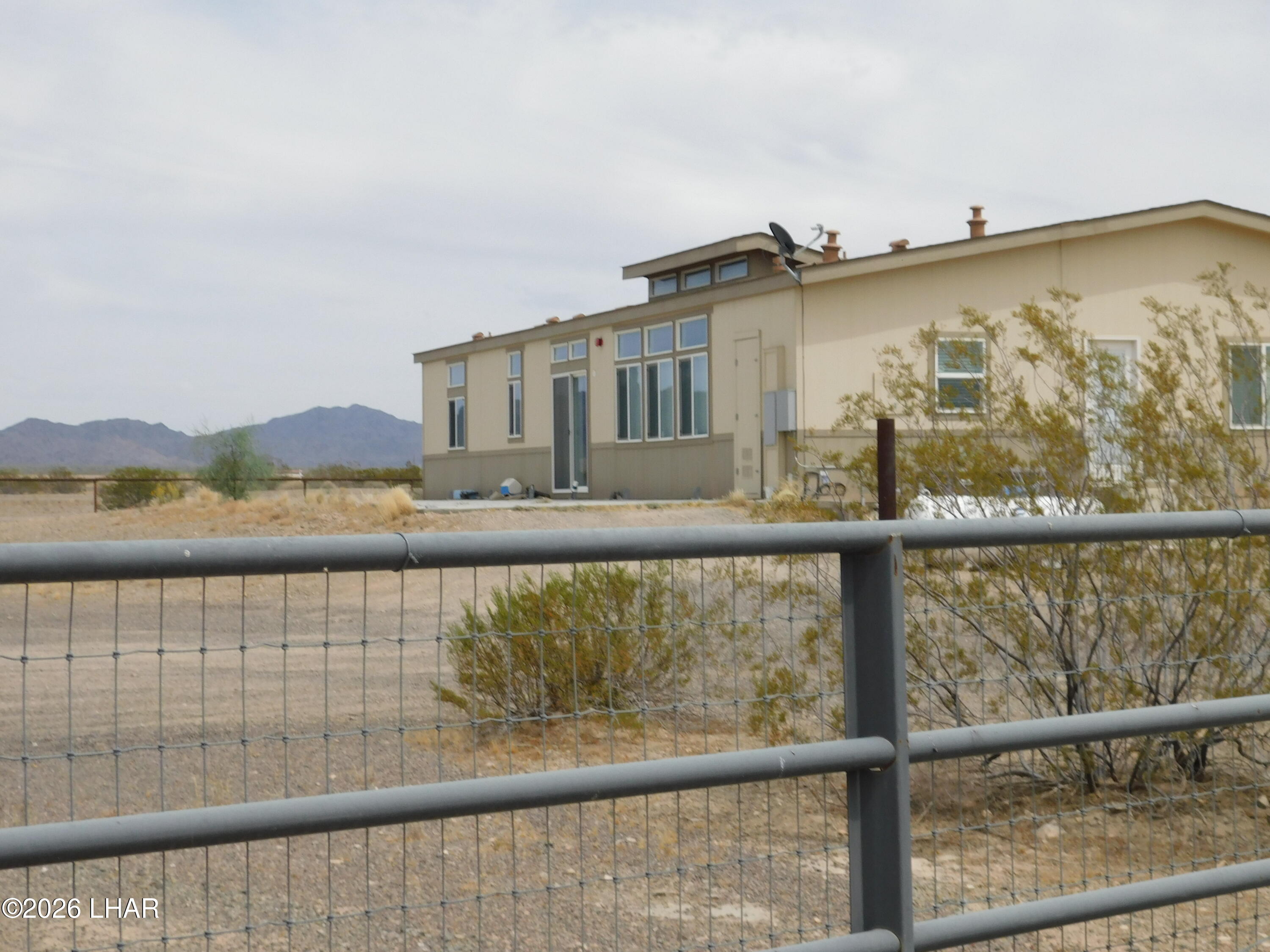 42159 Harms Way Salome, AZ 85348 - Photo 5 of 16 a view of a building from a lake