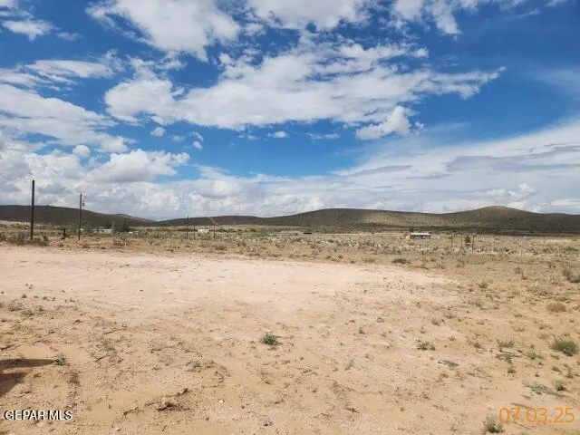 a view of a backyard of the house