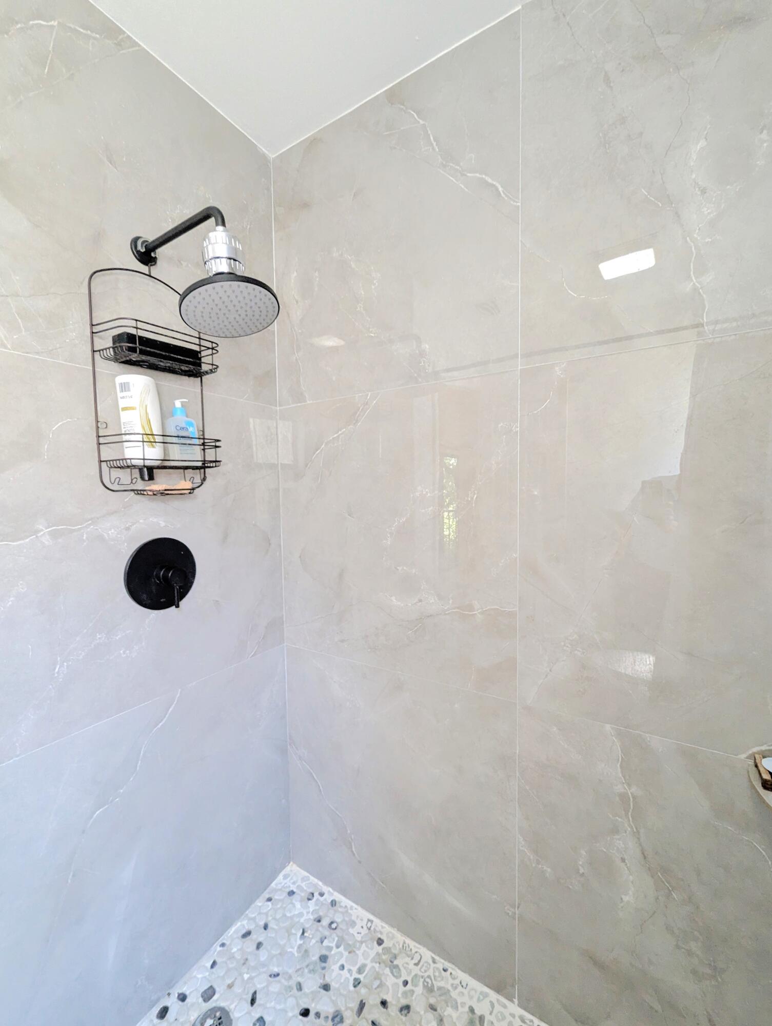3130 Millwood Terrace, Unit 2160 Boca Raton, FL 33431 - Photo 12 of 34 a bathroom with a shower