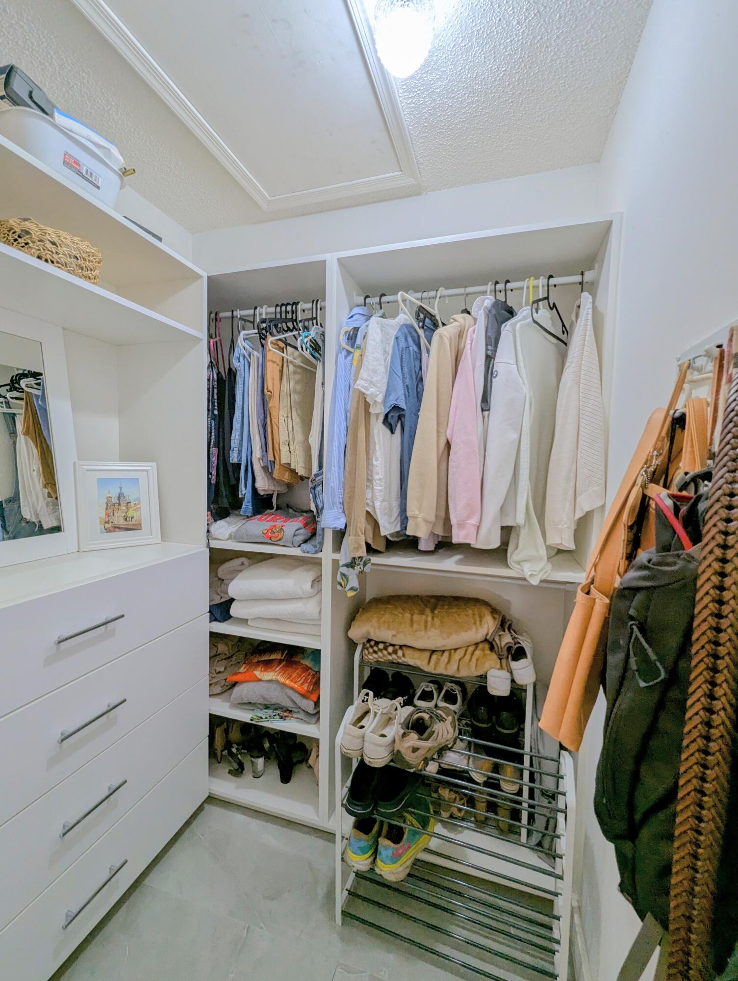 3130 Millwood Terrace, Unit 2160 Boca Raton, FL 33431 - Photo 15 of 34 a view of walk in closet with clothes and shoes