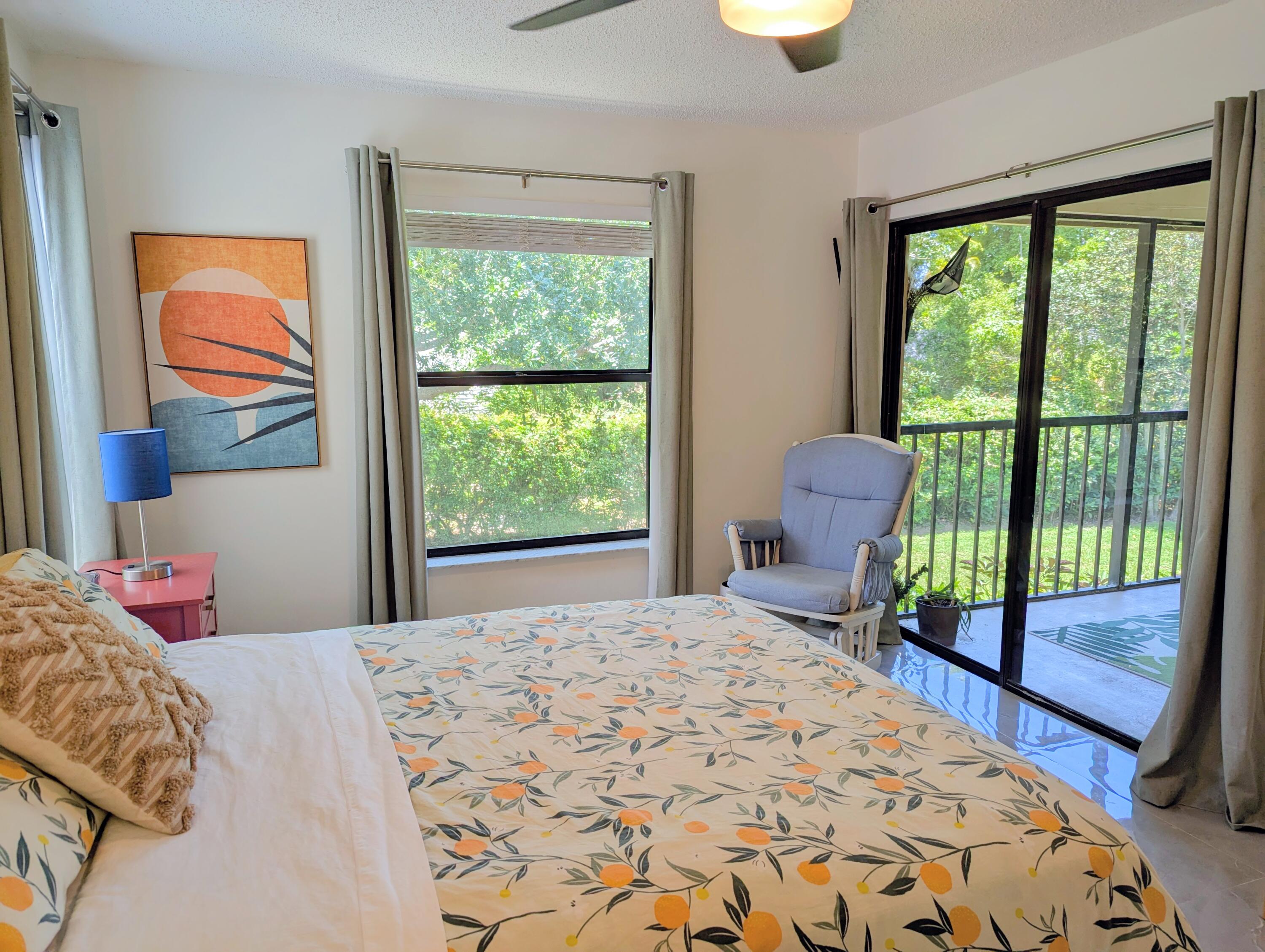 3130 Millwood Terrace, Unit 2160 Boca Raton, FL 33431 - Photo 10 of 34 a bedroom with a bed and a window