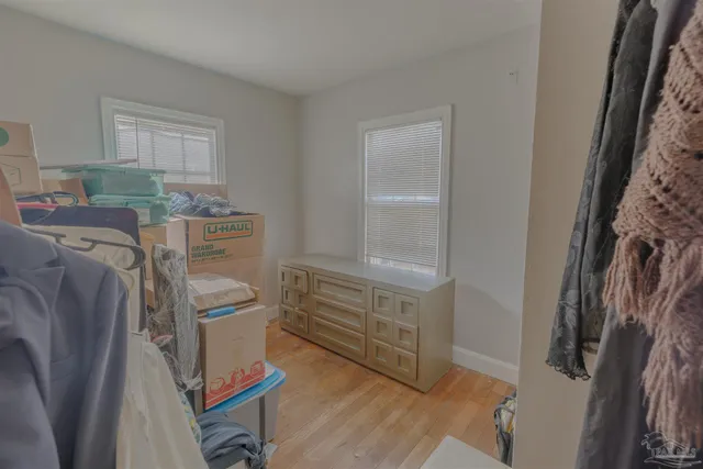 a view of a house with backyard and porch