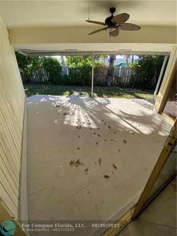 a view of a backyard with potted plants