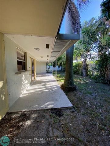a view of a patio with table and chairs a barbeque with potted plants and big trees