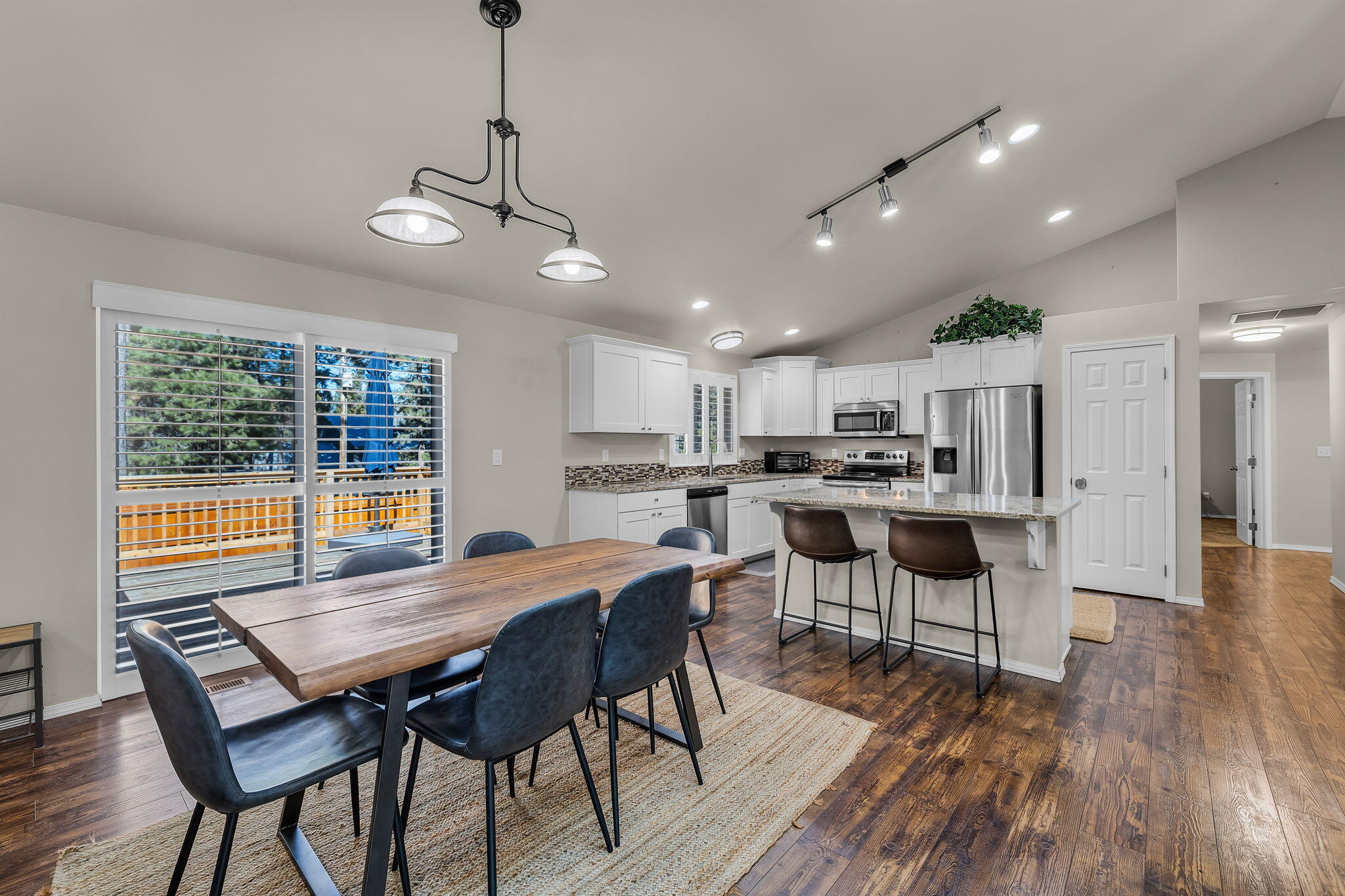 17064 Sacramento Road Bend, OR 97707 - Photo 13 of 50 a view of a dining room with furniture window and wooden floor