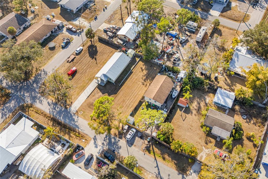 Hand Avenue Sarasota, FL 34232 - Photo 12 of 18 an aerial view of a house with a yard and flowers