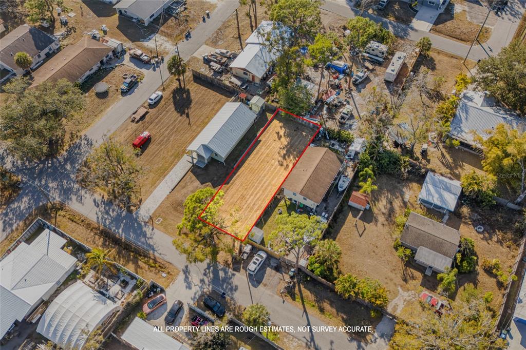 Hand Avenue Sarasota, FL 34232 - Photo 3 of 18 an aerial view of a house with a yard and trees