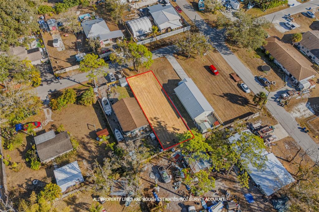 Hand Avenue Sarasota, FL 34232 - Photo 4 of 18 an aerial view of a house with a yard and garden