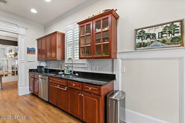 a kitchen with stainless steel appliances granite countertop a stove and a sink