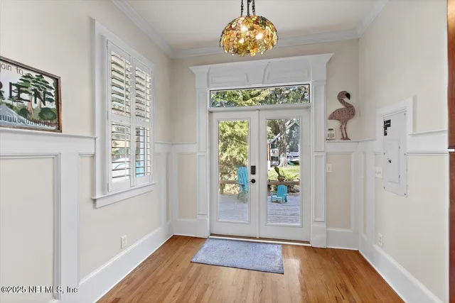 an entryway with wooden floor