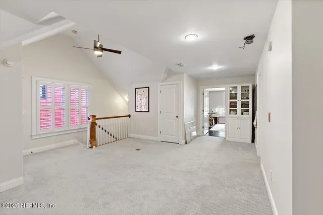 an empty room with windows and entrance